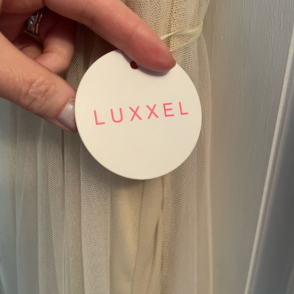 Long sheer ivory gown with lace bodice. - Picture 3 of 10